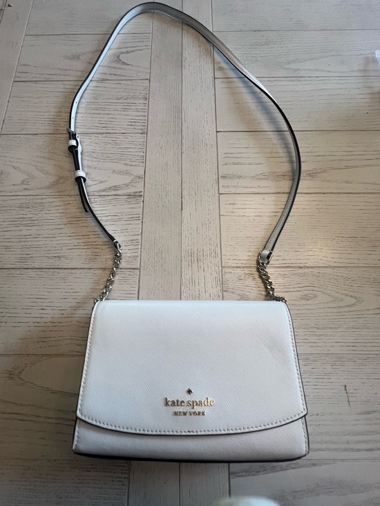 kate spade Handbags - Kate Spade White Crossbody Bag with Gold Accents